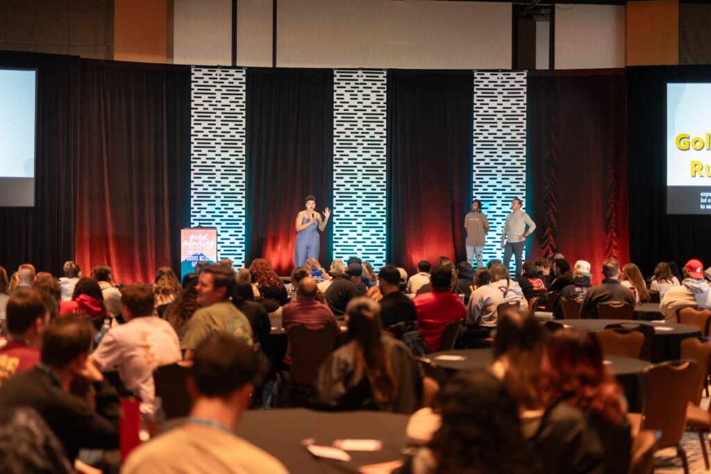 Extreme long shot of Christina delivering keynote speech at the Association of Fraternal Leadership & Values (AFVL) Central Conference 2024.