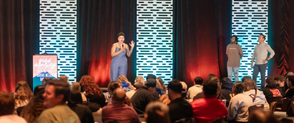 Extreme long shot of Christina delivering keynote speech at the Association of Fraternal Leadership & Values (AFVL) Central Conference 2024.